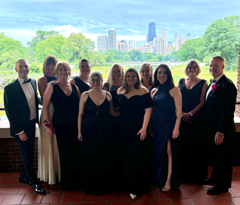 group of men and women in formal attire