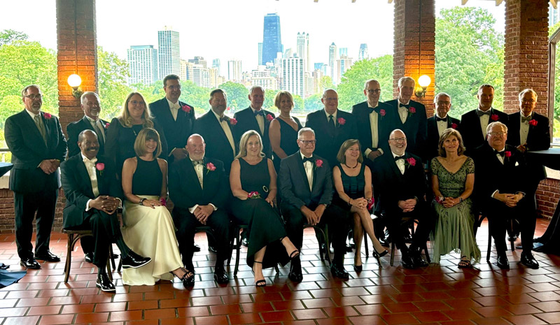 group of 22 men and women in formal attire